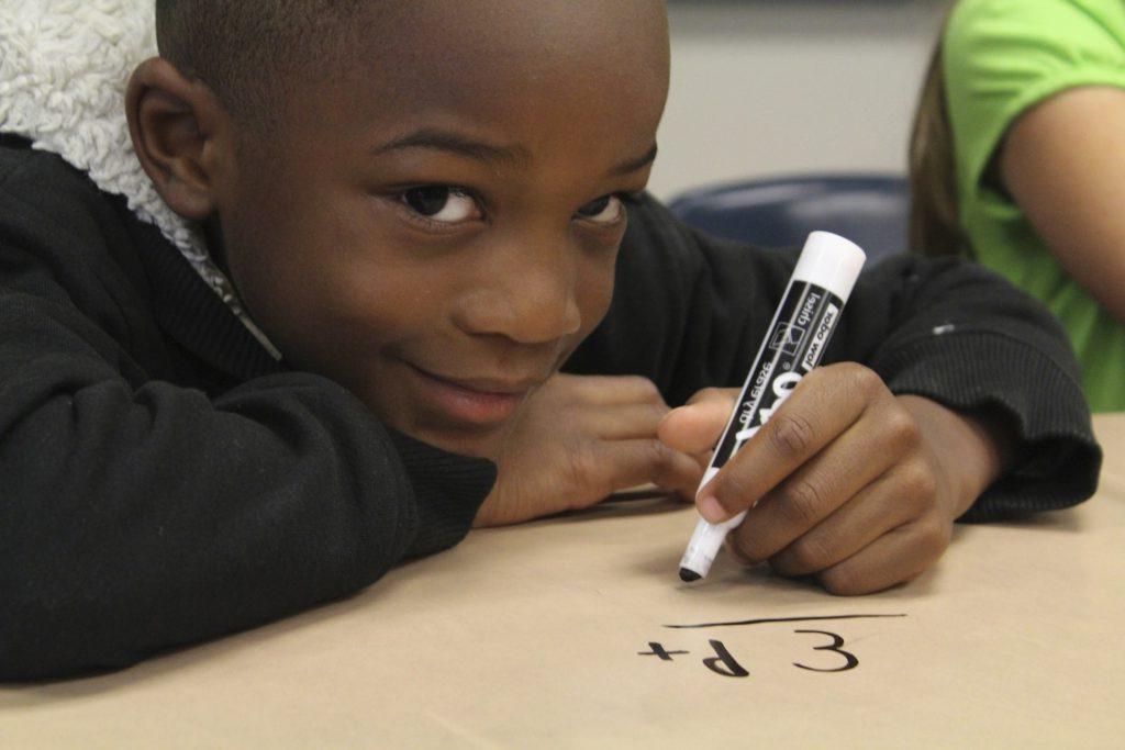 Boy doing math problem